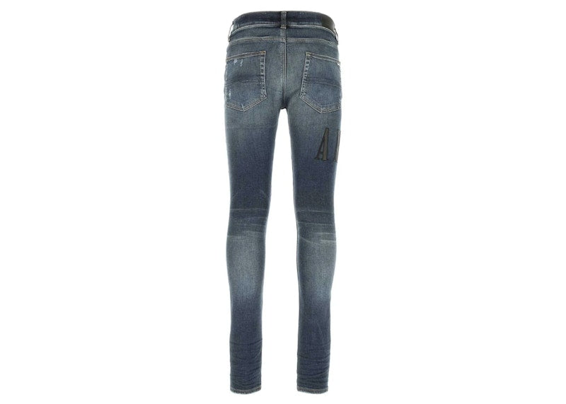 AMIRI Logo Patch Distressed Fitted Jeans Indigo