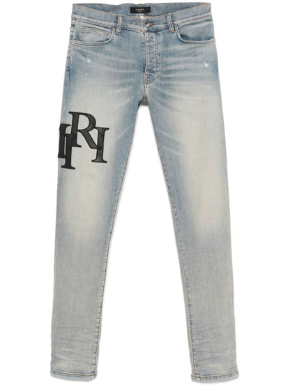 AMIRI Staggered Logo Skinny Jean Antique Indigo Black